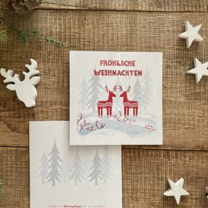 Handillustrierte quadratische Weihnachtsklappkarte Weihnachtswald zwei rote Hirsche Winterwald Fröhliche Weihnachten von Ann und Jan