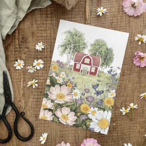 Postkarte "Sommerwiese". Ein Schwedenhaus inmitten blühender Wiesenblumen.